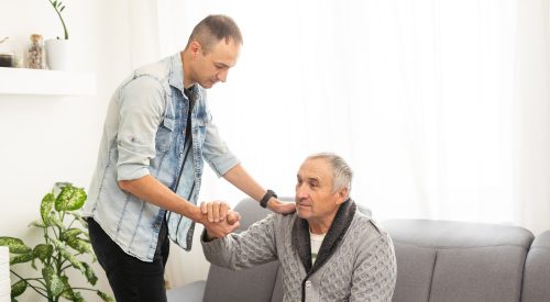 Elderly son takes care of ill father